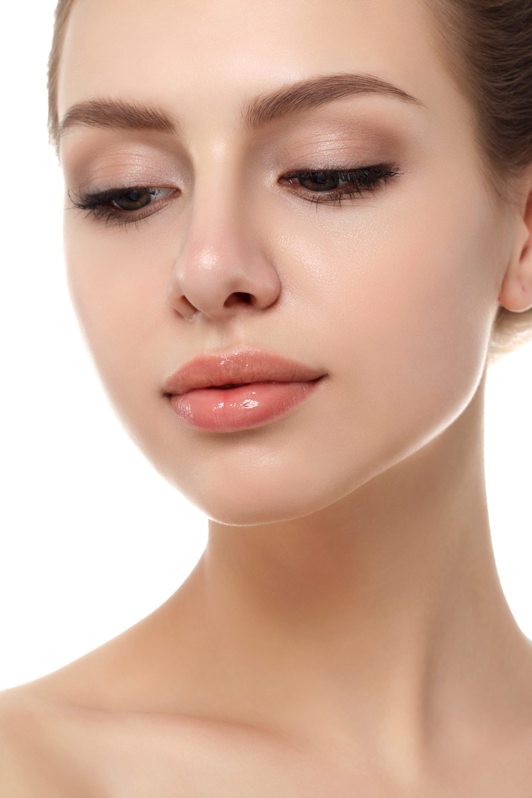Close up view of young beautiful caucasian woman isolated over white background. Lips contouring, SPA therapy, skincare, cosmetology and plastic surgery concept