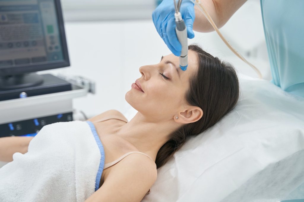 Woman with brown hair having a face lifting procedure
