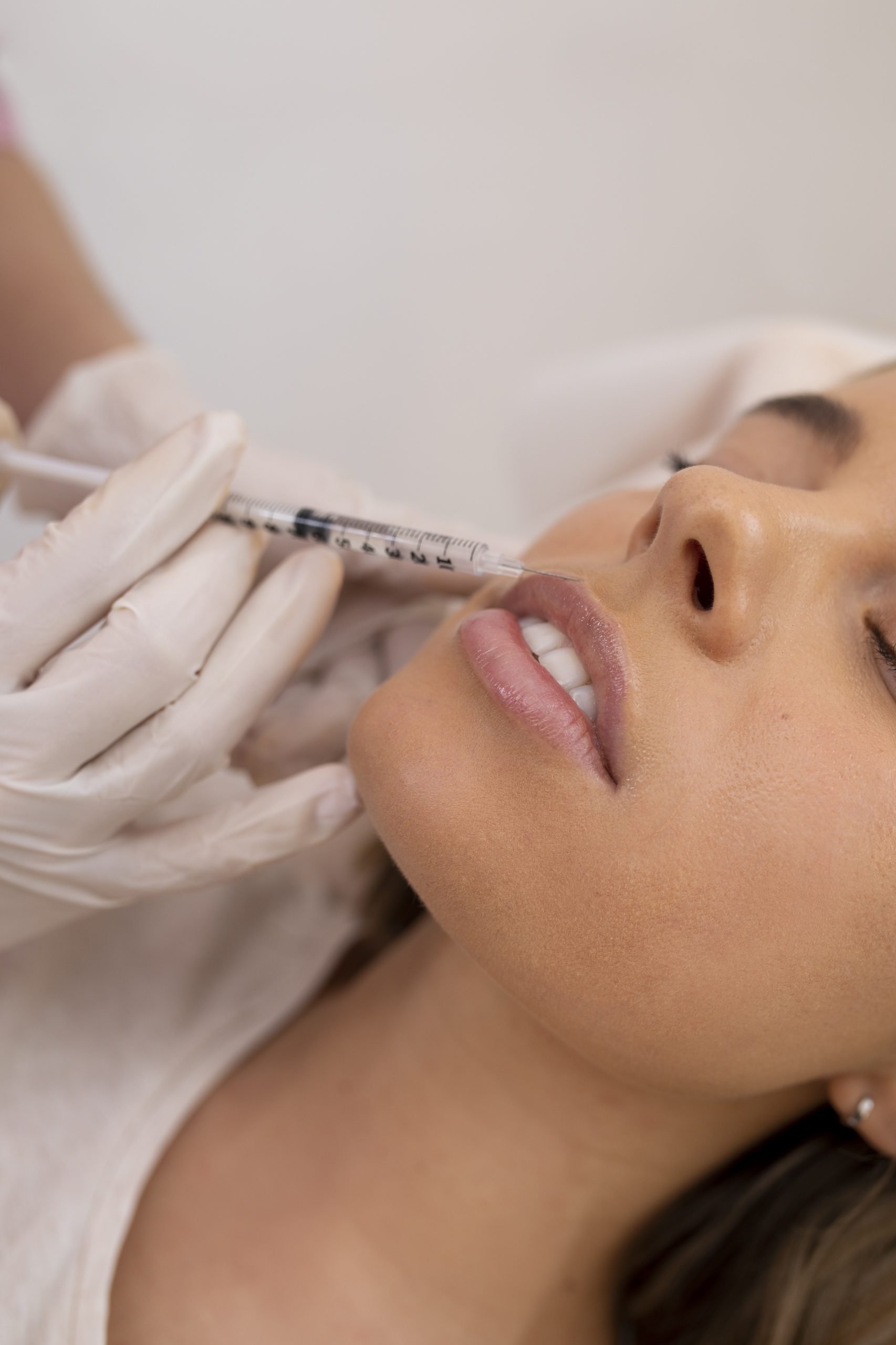 Close up of a woman who gets an injection in her lip