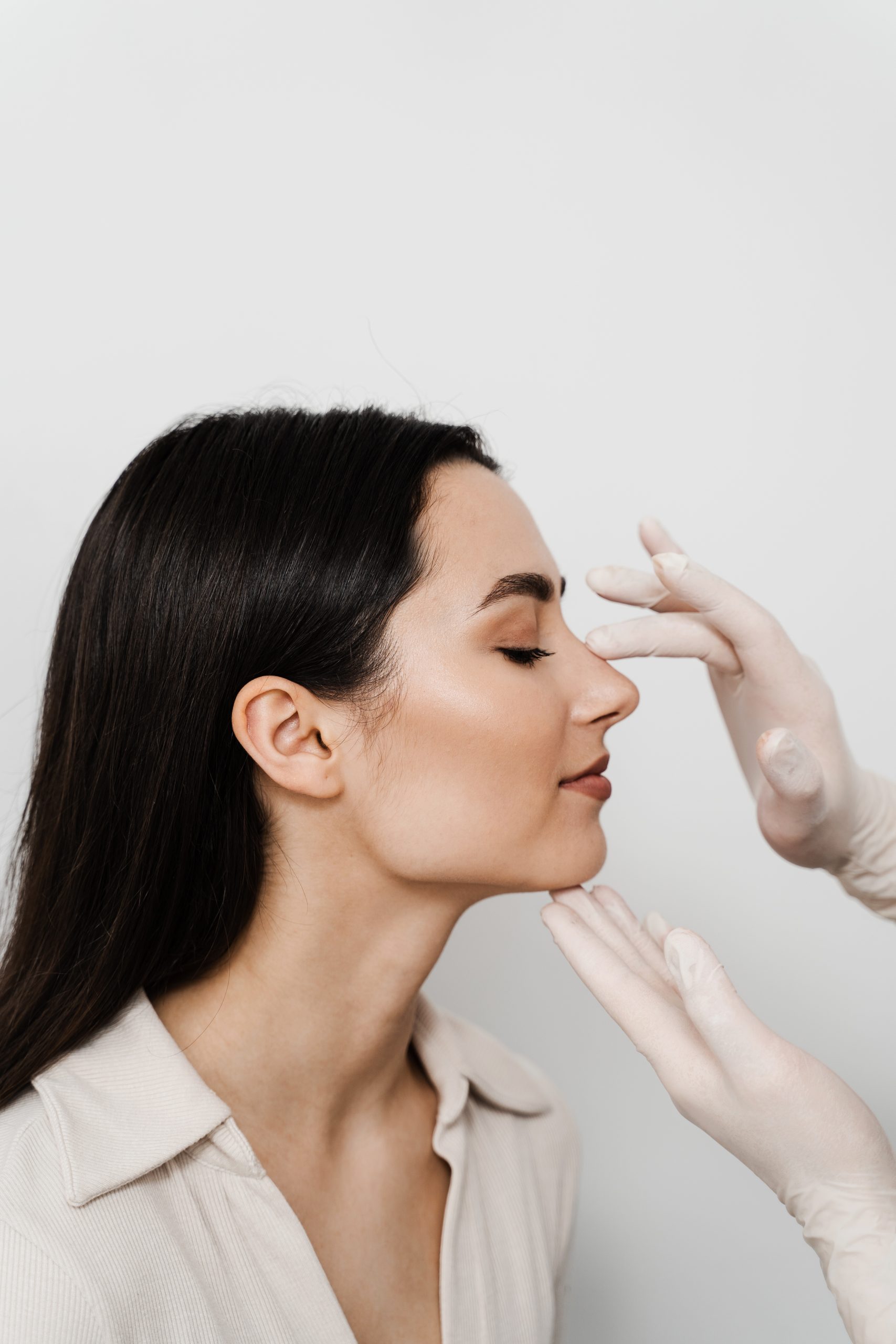 Consultation with ENT before rhinoplasty plastic surgery to change nose shape and improve breathing. Rhinoplasty is reshaping nose surgery for change appearance of the nose and improve breathing