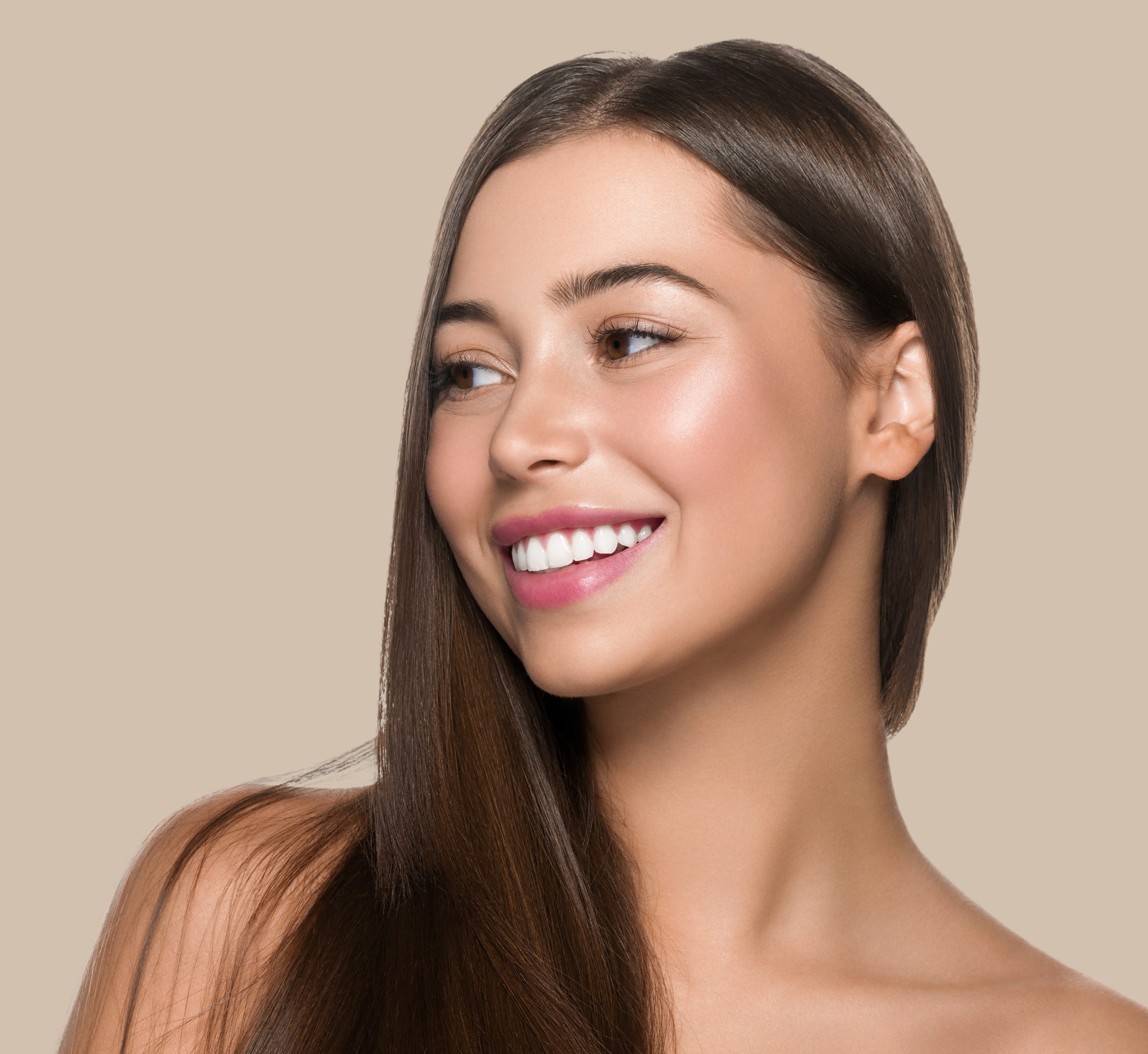 Smooth hair woman long hair beauty girl with pink lips. Color background. Brown.